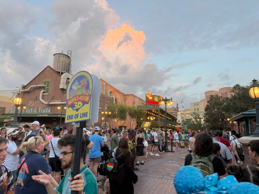 Muppet*Vision 3D end of line sign and PizzeRizzo in the sunset at Hollywood Studios