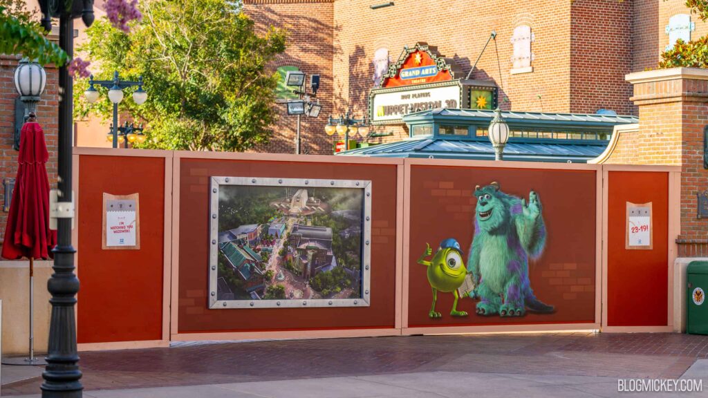 Photo of construction walls now up outside of the former Muppets Courtyard/future Monsters Inc Land with new concept art (photo from BlogMickey)